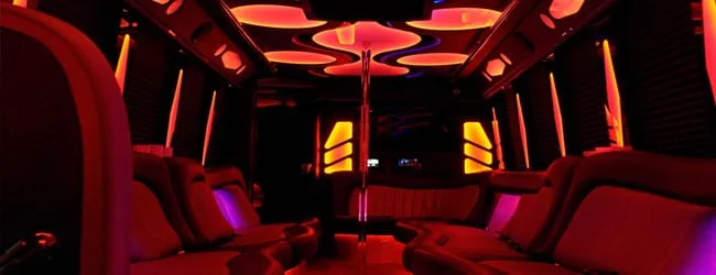 Red-lit interior of the Newport party bus